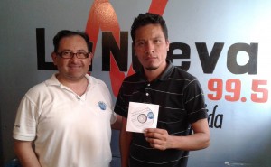 Karel (left) providing programs to the  Director of a radio station in Santa Rosa